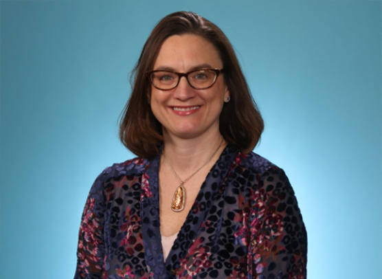 Dr. Stacey Rentschler, cardiovascular researcher and physician-scientist, in a professional studio portrait.