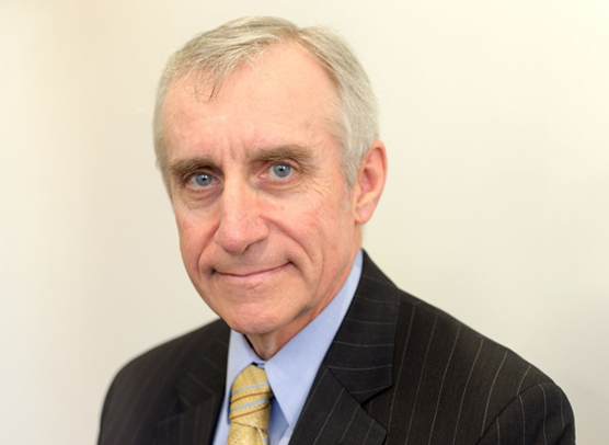 Dean Ertwine, retired Army colonel and government affairs director, in a formal professional portrait.