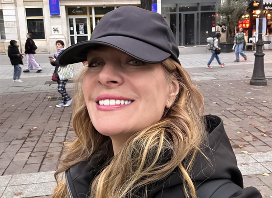 Angie Jordan, digital caricature artist and author, in a casual outdoor photo.