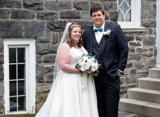 Dr. Charles Schmidt poses with his wife Erin on their wedding day.